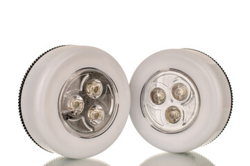 Two flashlights on batteries, macro, isolated on white background.