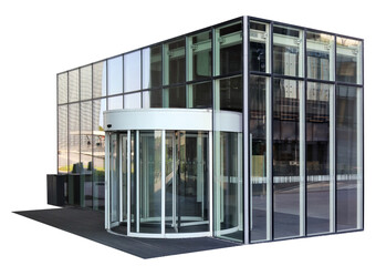 A round rotating turnstile is installed at the entrance to a glass office building isolated