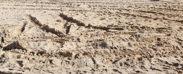 A lot of sand with traces of construction equipment