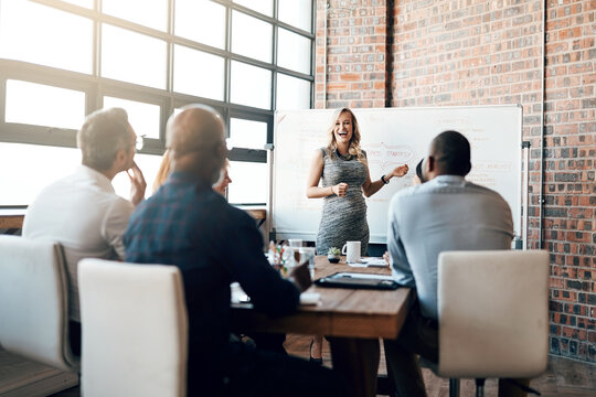 Woman, business and presentation in office for meeting with discussion, brainstorming for ideas. Female manager, happiness and group for planning with teamwork, workshop for professional training