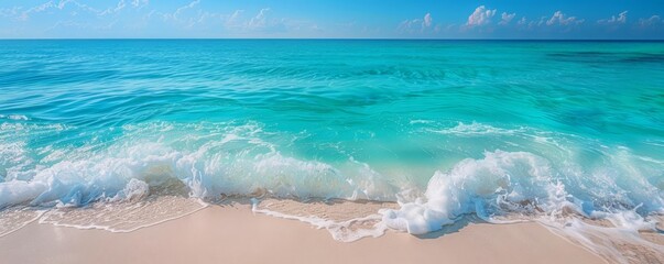 Photograph a coastal scene with crystalclear turquoise water lapping against a white sandy beach