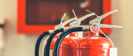 The red fire extinguisher is ready for use in case of an indoor fire emergency.	