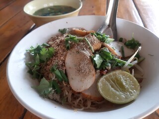 A Bowl of Delicious Noodles with Fish Balls