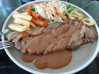 Grilled Steak with Gravy Fries and Salad