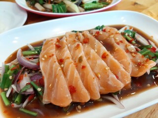 Spicy Salmon Salad on a White Plate