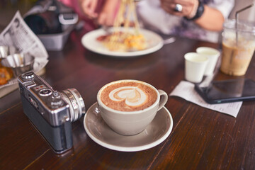 Coffee cup on the table in the coffee shop
