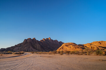 The Spitzkoppe  is a group of bald granite peaks or inselbergs located between Usakos and Swakopmund in Namib desert I Namibia, sunset photo
