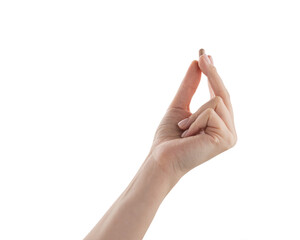 Female hand hold beige pill isolated on white