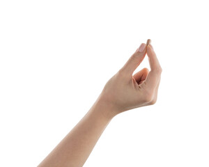 Female hand hold beige pill isolated on white