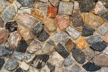 hard stones stack or modern rock wall dam and brown gray granite floor or yellow black stone jigsaw in concrete on top view for strong background or texture wallpaper with architecture construction