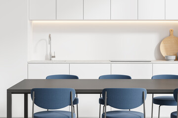 Modern home kitchen interior with eating table and cooking cabinet