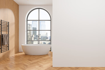 Luxury home bathroom interior with bathtub and panoramic window. Mockup wall