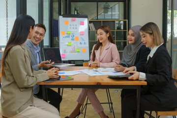 Group of business people having a meeting in a tech company. Creative business professionals planning a project in an office. Teamwork and collaboration in a modern workplace.