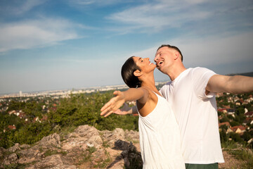 Smiling mid adult couple hugging each other