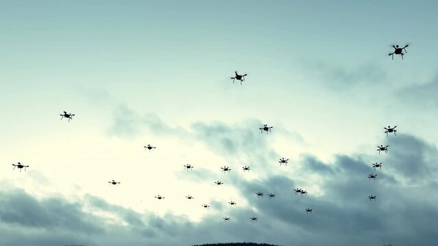 Swarm of drones flying in the sky. Numerous drones flying, a cloudy sky, captures the advanced technology and coordination of drone operation.