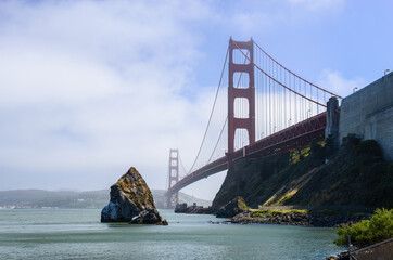 Naklejka premium The Golden Gate Bridge in the mist, taken from the Marin County side. California.