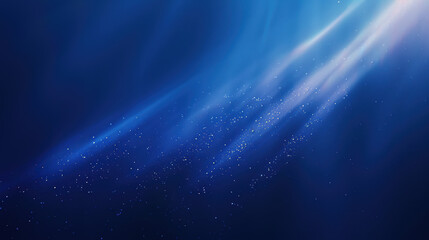 A serene underwater scene with blue light rays piercing through water, illuminating tiny particles. Perfect for aquatic-themed backgrounds or designs.