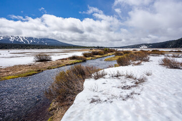 Beautiful landscape in early spring with melting snow on a meadow in Mt. Bachelor area in Oregon