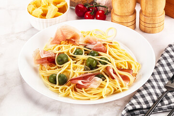Pasta spaghetti with olives and jamon