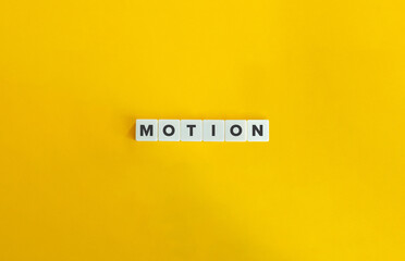 Motion Word. Fundamental Concept in Physics. Text on Block Letter Tiles on Flat Background....
