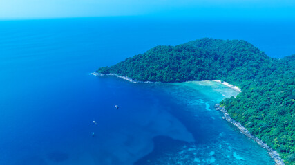 The tropical island with seashore as the island in a coral reef ,blue and turquoise sea Amazing...
