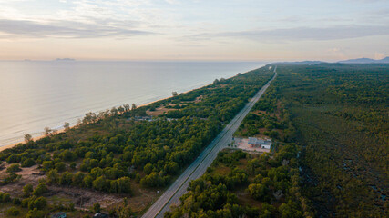 Aerial drone view of  coastal highway scenery at Pantai Jambu Bongkok, Marang, Terengganu, Malaysia