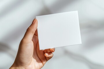 Obraz premium Blank White Card Mockup on Hand created with Generative AI