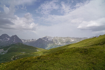 Fototapeta premium Beautiful views over the mountains with snow on the top of the mountains. The nature while hiking the Tour du Mont Blanc. 