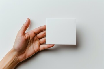 Obraz premium Blank White Card Mockup on Hand created with Generative AI