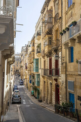 Tipical street of La Valletta with wooden terraces in Malta.