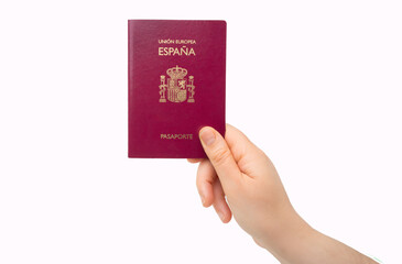 Hand of hispanic man holding spanish passport over isolated white background.