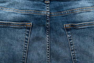 Fototapeta premium Texture of jeans with pockets. Back view. Denim