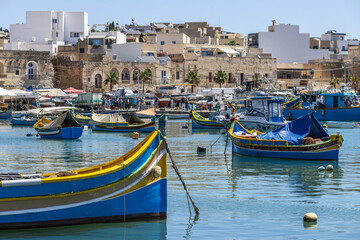 Obraz premium Boats into the harbour of Marsaxlokk, Malta island