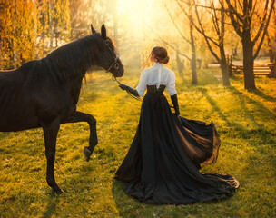 fantasy woman walking with black horse. Happy adult girl turned away Beauty lady back rear view....
