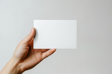 Obraz premium Blank White Card Mockup on Hand created with Generative AI