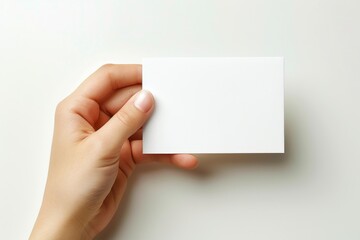 Obraz premium Blank White Card Mockup on Hand created with Generative AI
