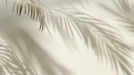 Fototapeta premium Blurred shadow palm leaves on light cream wall, design clean art concept