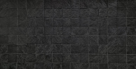 dark black stamp concrete floor in grid pattern. printed concrete in square pattern texture...
