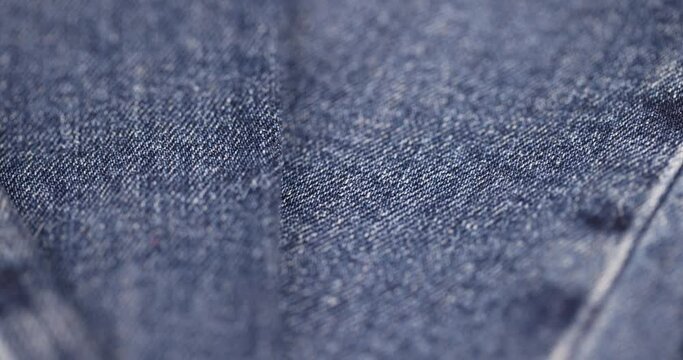 blue soft denim fabric for sewing clothes, details of clothes made of blue denim soft fabric