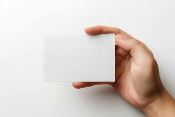 Obraz premium Blank White Card Mockup on Hand created with Generative AI