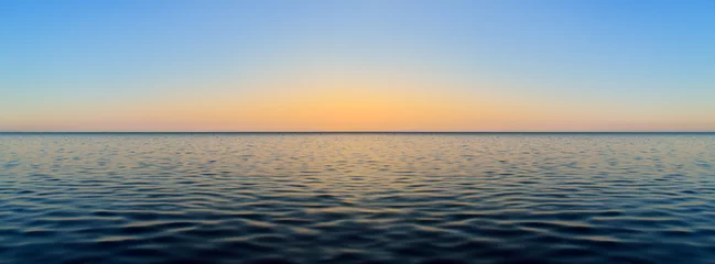 Fotobehang Panorama of sea waves on the background of dawn © Oleksandrum