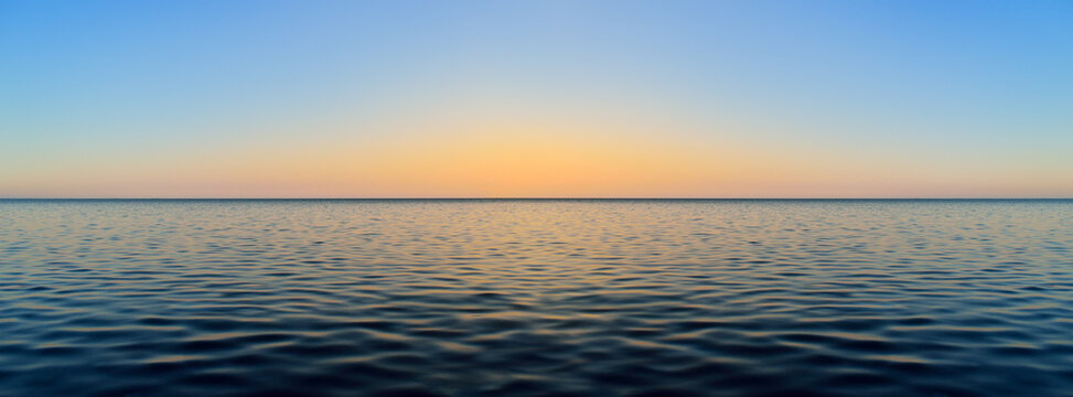 Panorama of sea waves on the background of dawn