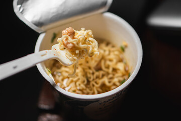 Cup of Instant Noodles with Fork