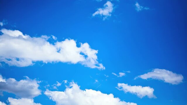 Clouds Moving over a Clear, Blue Sky (time lapse nature background)
