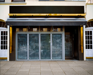 closed Italien restaurant in the urban city, impact of the coronavirus 2021 in Germany, dirty window front.