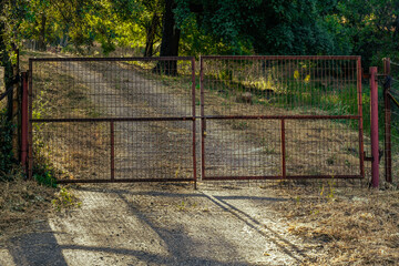 Gate of a farm in the countryside in Sierra Madrona, Fuencaliente, Ciudad Real Province, Spain