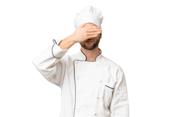 Young handsome chef man over isolated background covering eyes by hands. Do not want to see something