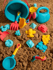 Still life from a sand children's set on the sand in sunny weather
