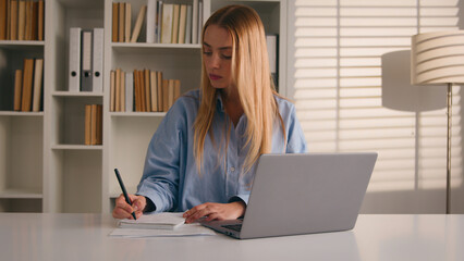 Fototapeta premium Caucasian female student author journalist at home office library learner woman businesswoman write business idea writing notes dissatisfied displeased mistake rip sheet of paper throw away crumpling