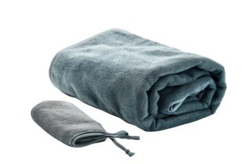 Folded blue towel and gray washcloth on white background. Ideal for spa, bathroom decor, and cleanliness concepts.